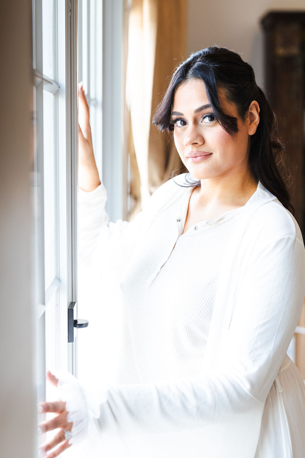 Ana photographed in soft window light while getting ready
