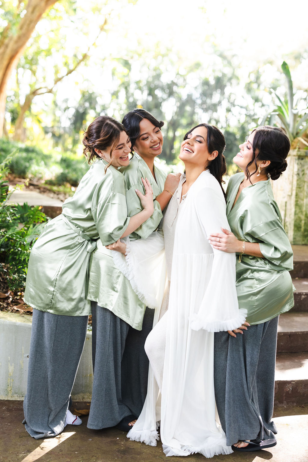 Ana sharing a joyful getting-ready moment with her wedding party