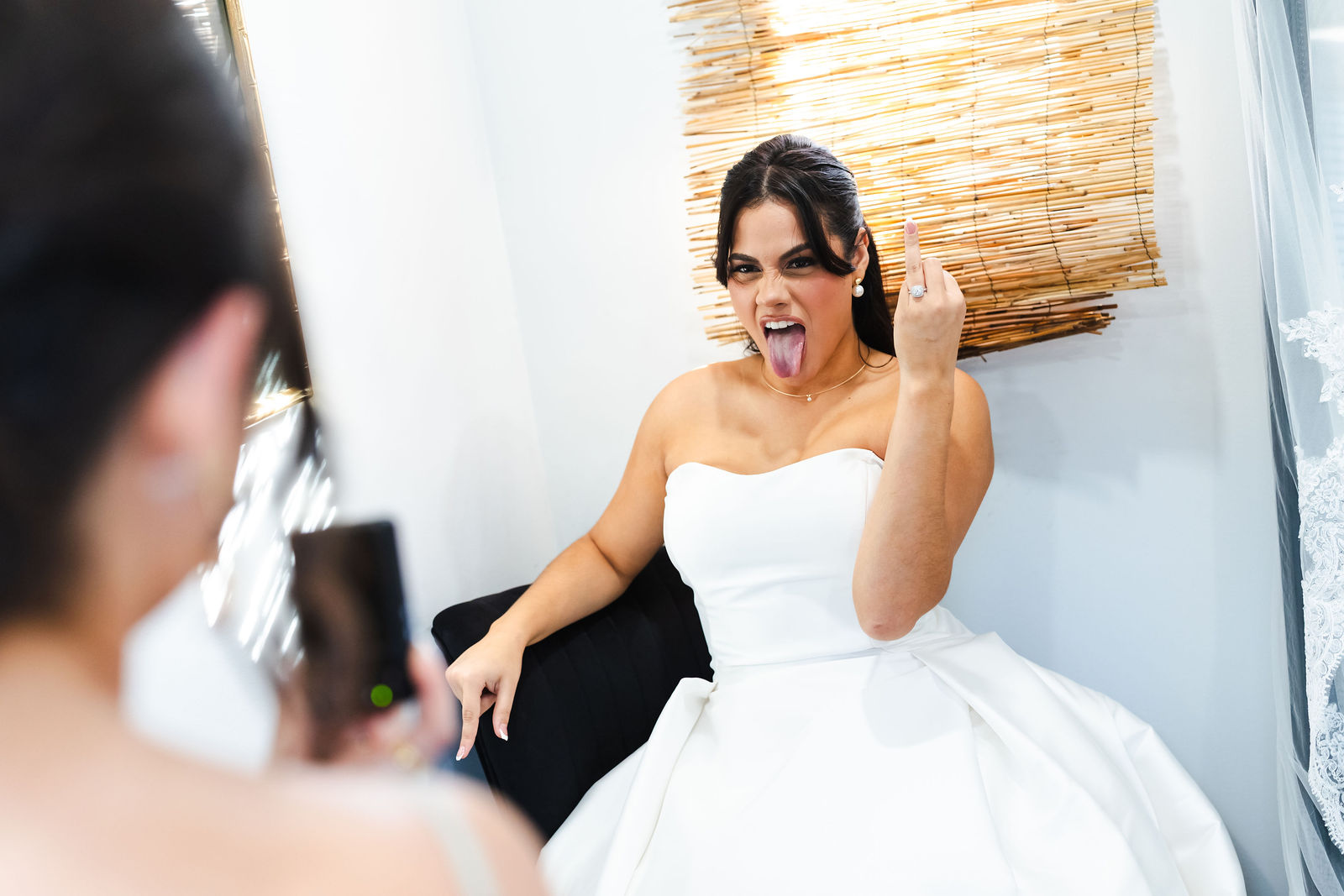A playful candid portrait of Ana while getting ready