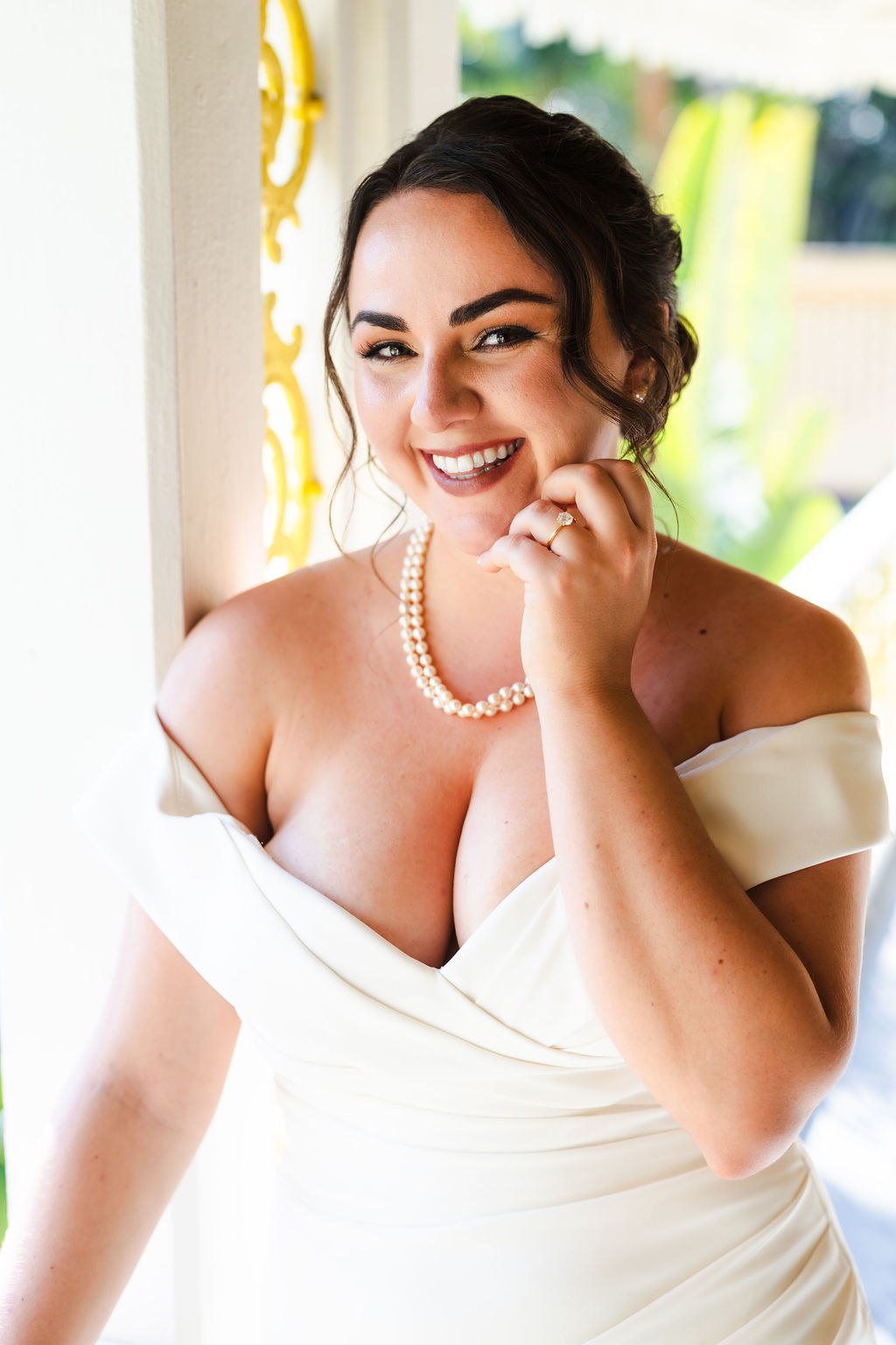 Sara smiling in her wedding dress before the ceremony