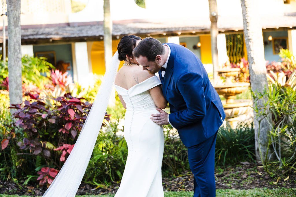 Brett kissing Sara’s forehead in the garden