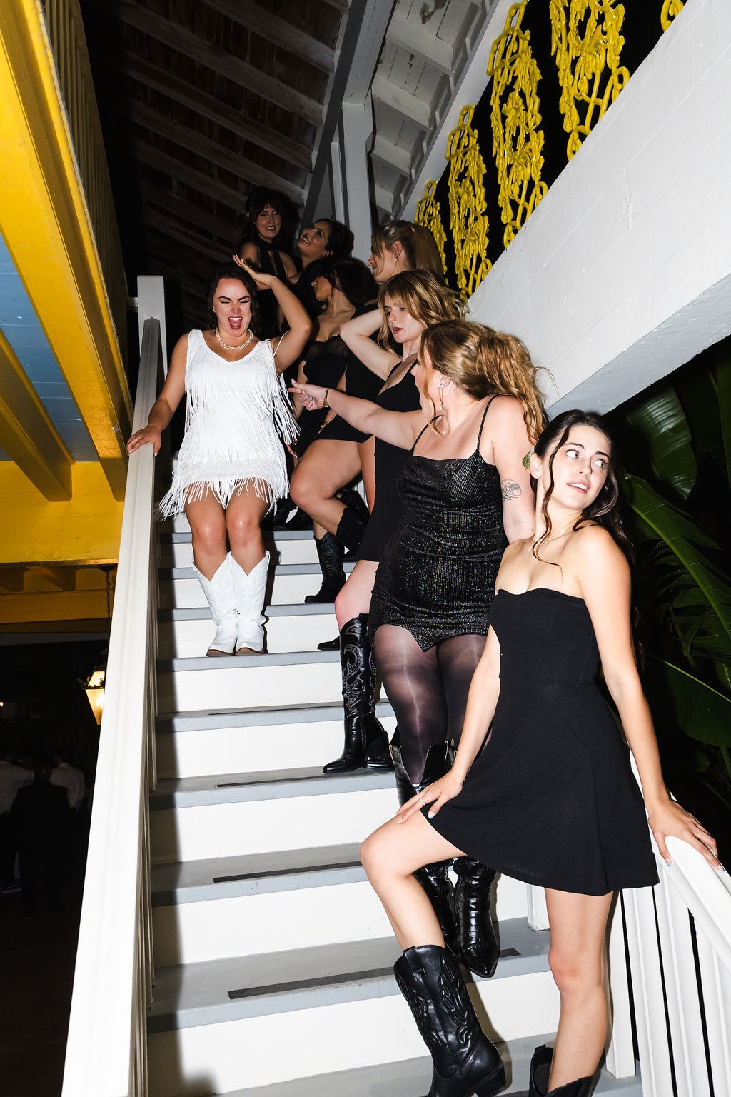 Sara and friends gathered on the estate stairs in the evening
