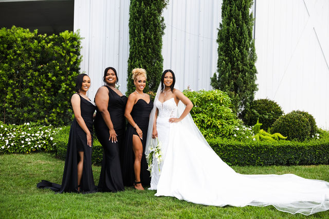 Netania and her wedding party in black and white attire