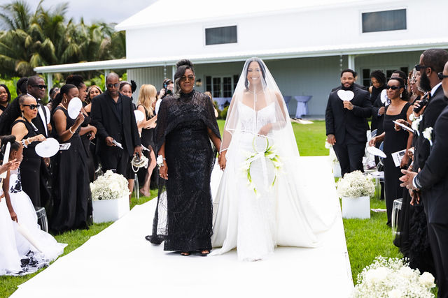 Netania walking down the aisle with her mother
