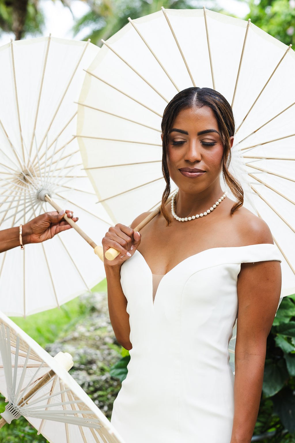 Close bridal portrait of Sharlena with her white parasol