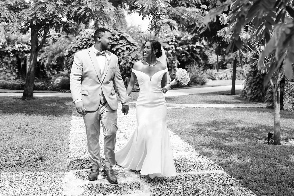 Black-and-white photograph of Adrian and Sharlena walking together