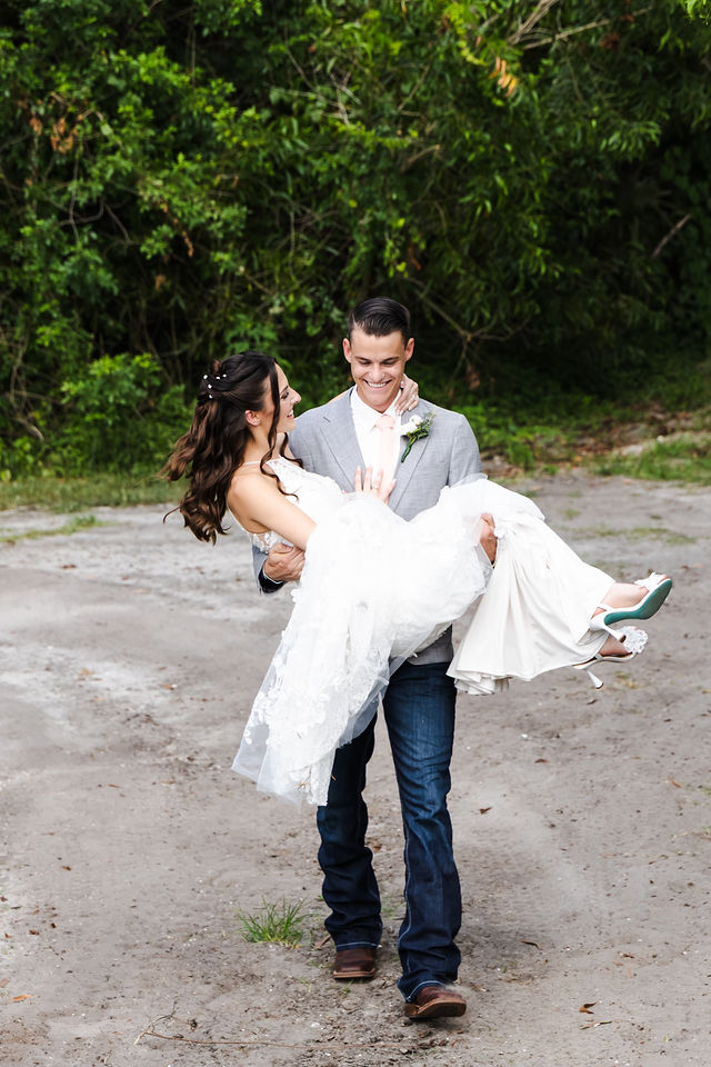 Trace carrying Haley beside the bridge