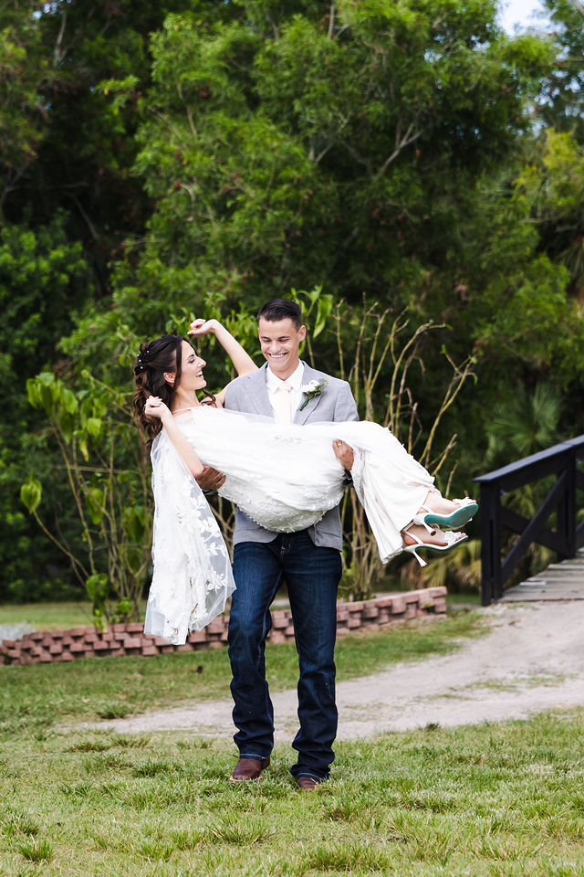 Playful wedding portrait on the open lawn