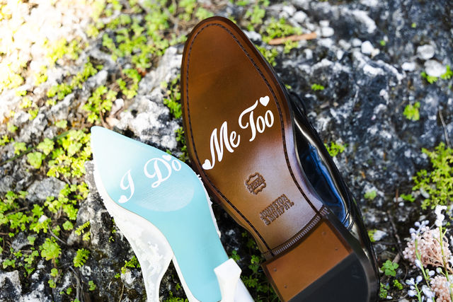 Personalized wedding shoes displayed in the garden