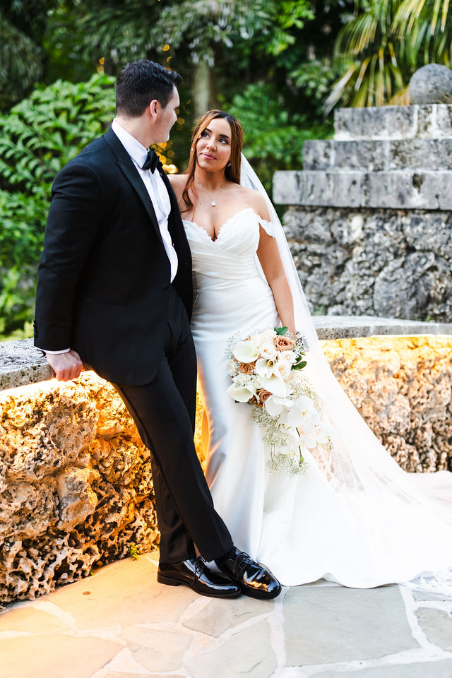 Newlyweds sharing a quiet moment in the gardens