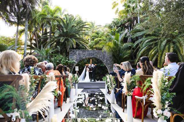 Garden ceremony surrounded by tropical foliage