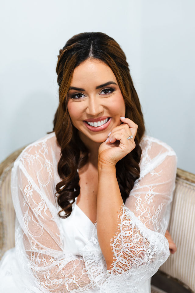 Sarah smiling while getting ready