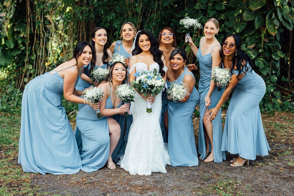 Karina laughing with her bridal party in the gardens