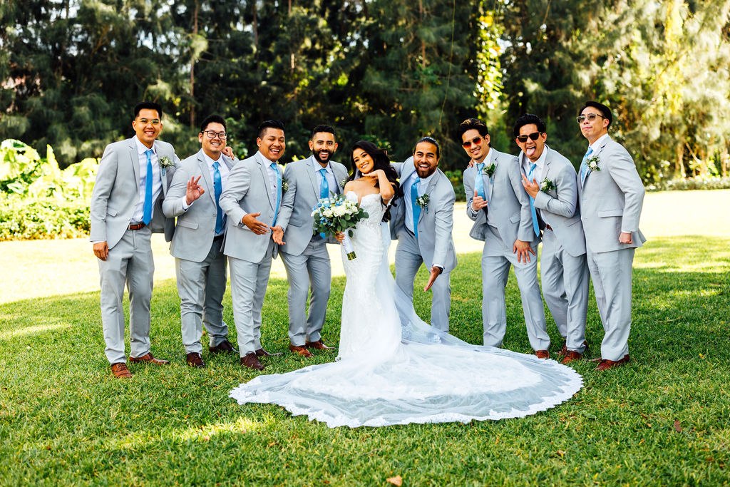 Dao and Karina celebrating with the groom’s wedding party on the lawn