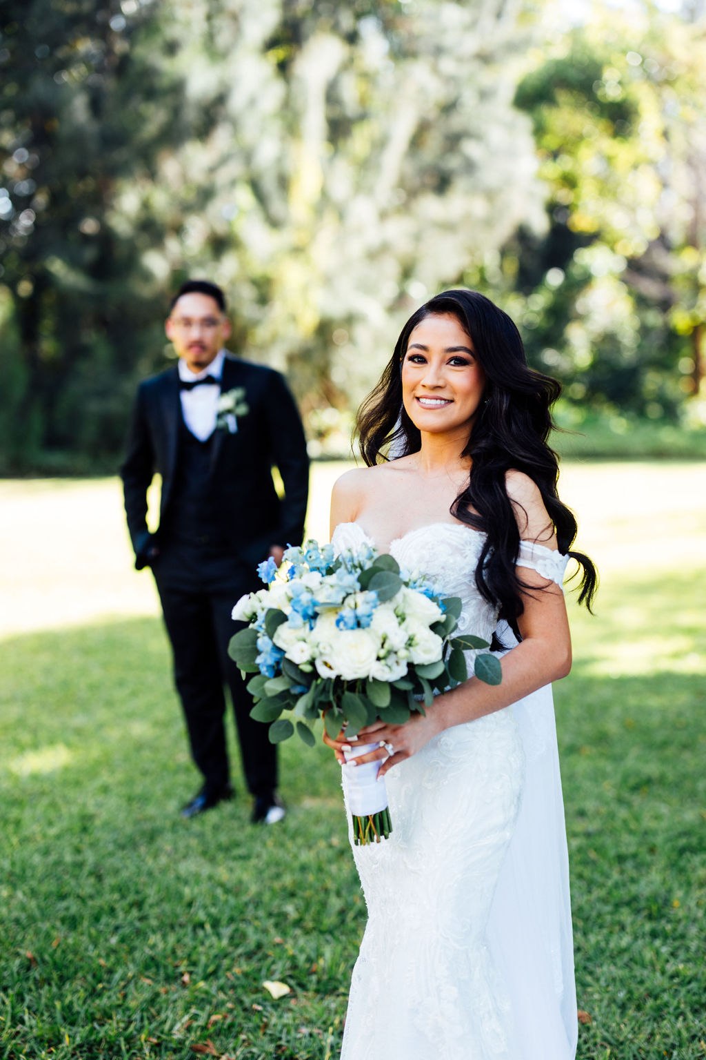 Karina in the foreground with Dao behind her on the garden lawn